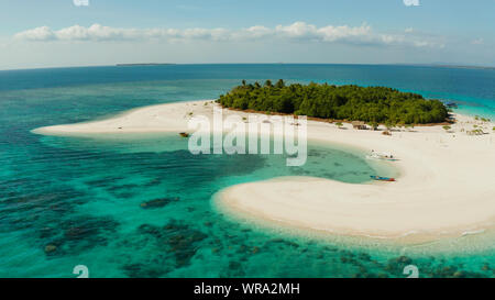 Tropical island with beautiful beach, palm trees and turquoise water view from above. Patawan island with sandy beach. Summer and travel vacation concept.