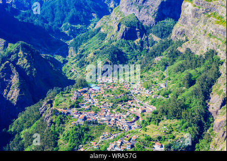 View from Eira do Serrado to Curral das Freiras village in the Nuns Valley in beautiful mountain scenery, municipality of Câmara de Lobos, Madeira isl Stock Photo