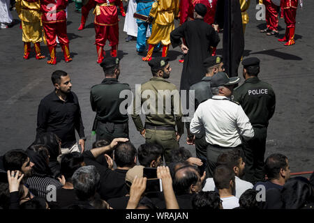 Tehran, Tehran, Iran. 10th Sep, 2019. Police officers are seen as Iranians perform at the Ashura ceremonies in Tehran, Iran. The Ashura day commemorates the death anniversary of the third Shiite Imam Hussein, who was the grandson of Muslim Prophet Muhammed. Ashura is the peak of ten days of mourning when Shiite Muslims mourn the killing of Imam Hussein whose shrine is in Karbala in southern Iraq. Credit: Rouzbeh Fouladi/ZUMA Wire/Alamy Live News Stock Photo