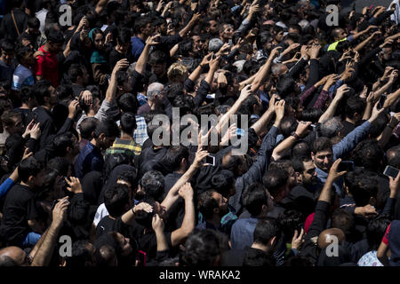 Tehran, Tehran, Iran. 10th Sep, 2019. People use their mobile phone to take photos as Iranians perform at the Ashura ceremonies in Tehran, Iran. The Ashura day commemorates the death anniversary of the third Shiite Imam Hussein, who was the grandson of Muslim Prophet Muhammed. Ashura is the peak of ten days of mourning when Shiite Muslims mourn the killing of Imam Hussein whose shrine is in Karbala in southern Iraq. Credit: Rouzbeh Fouladi/ZUMA Wire/Alamy Live News Stock Photo