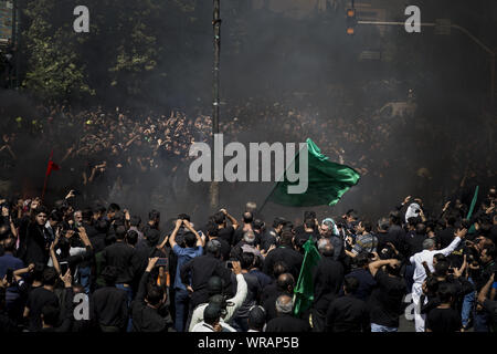Tehran, Tehran, Iran. 10th Sep, 2019. Iranians burn a tent as they perform at the Ashura ceremonies in Tehran, Iran. The Ashura day commemorates the death anniversary of the third Shiite Imam Hussein, who was the grandson of Muslim Prophet Muhammed. Ashura is the peak of ten days of mourning when Shiite Muslims mourn the killing of Imam Hussein whose shrine is in Karbala in southern Iraq. Credit: Rouzbeh Fouladi/ZUMA Wire/Alamy Live News Stock Photo
