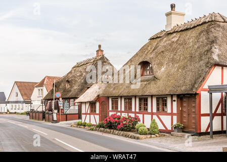 Old thatched half-timbered houses along the street to Thoro in Svendborg, Denmark, July 10, 2019 Stock Photo