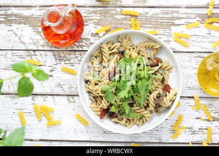 Fusilli pasta with sun-dried tomatoes, parmesan cheese Stock Photo