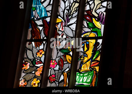 10 September 2019, Bavaria, Bamberg: The sun shines through the window of the painter and sculptor Lüpertz in the St. Elisabeth Church in Bamberg. The first of a total of eight windows with the title 'The old woman - giving alms' was previously uncooled. It shows, like the following windows, a scene from the life of Saint Elizabeth. Photo: Daniel Karmann/dpa Stock Photo