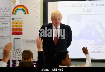 Prime Minister Boris Johnson during a visit to Pimlico Primary school in South West London, to meet staff and students and launch an education drive which could see up to 30 new free schools established. Stock Photo