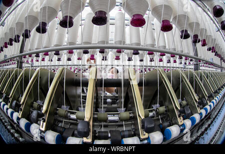 Female worker in a textile factory Stock Photo - Alamy