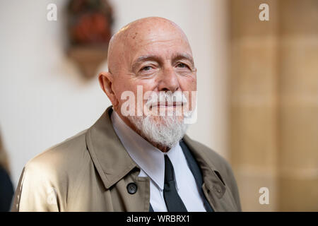 Bamberg, Germany. 10th Sep, 2019. Markus Lüpertz, painter and sculptor, stands in the St. Elisabeth Church in Bamberg. In the church the first of a total of eight windows with the title 'The old woman - giving alms' was unveiled. It shows, like the following windows, a scene from the life of Saint Elizabeth. Credit: Daniel Karmann/dpa/Alamy Live News Stock Photo