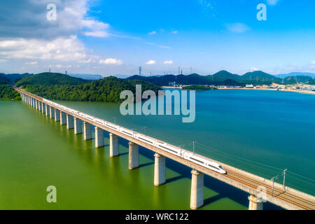 **FILE**This aerial view shows a CRH (China Railway High-speed) bullet train travelling through a bridge on a high-speed railway in Ningbo City, east Stock Photo