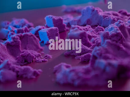 Macro photo of purple color sand. abstract landscape. Stock Photo