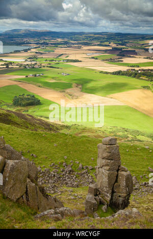 Looking over Loch Leven form Bishop Hill with the natural stone outcrop Carlin Maggie in the foreground , Perth and Kinross, Scotland Stock Photo