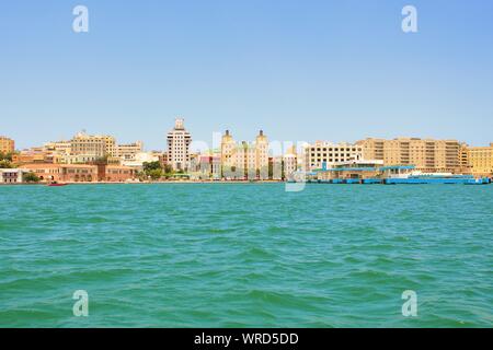 Landscape view from the water, of the port and cruise ship terminal, and the surrounding town, in San Juan, the capital city of Puerto Rico. Stock Photo