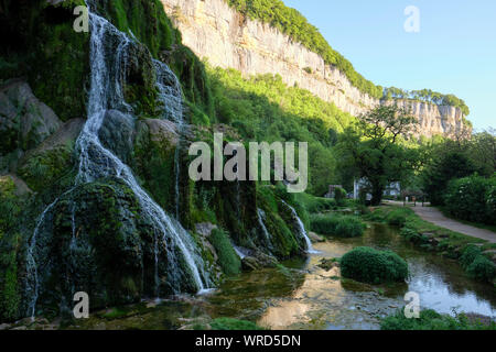 Cascade des Tufs or Cascade Baume les Messieurs waterfall and Karst limestone cliffs of the Dard river valley Franche Comte / Jura, France. Stock Photo