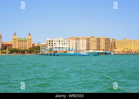 Landscape view from the water, of the port and cruise ship terminal, and the surrounding town, in San Juan, the capital city of Puerto Rico. Stock Photo