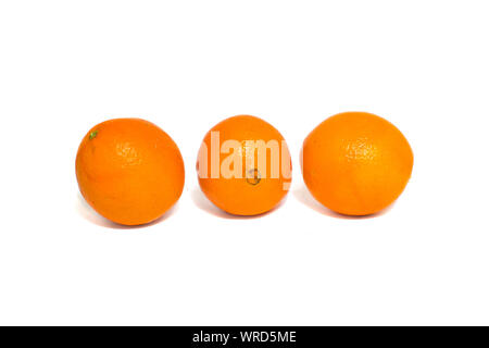 Three fresh oranges isolated on white background. Stock Photo