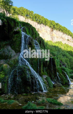 Cascade des Tufs or Cascade Baume les Messieurs waterfall and Karst limestone cliffs of the Dard river valley Franche Comte / Jura, France. Stock Photo