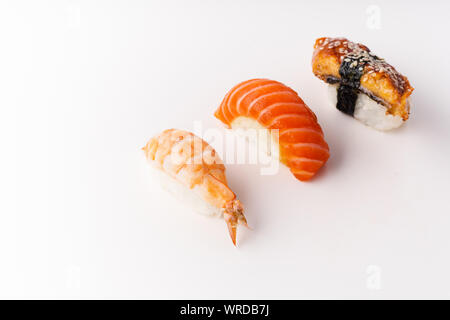Creative layout with various sushi on white background. Shrimp, eel, salmon. Stock Photo