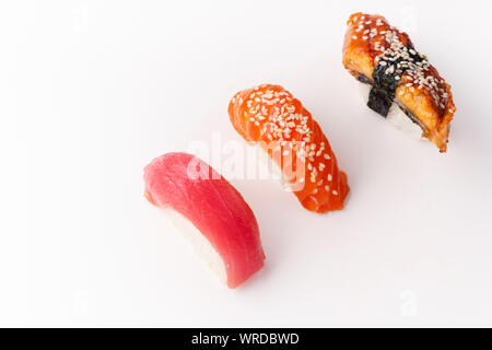 Creative layout with various sushi on white background. Shrimp, eel, tuna. Stock Photo