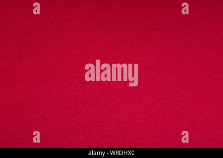 Soft texture of the fabric in bright red. High resolution photo. felt, fleecy textile Stock Photo