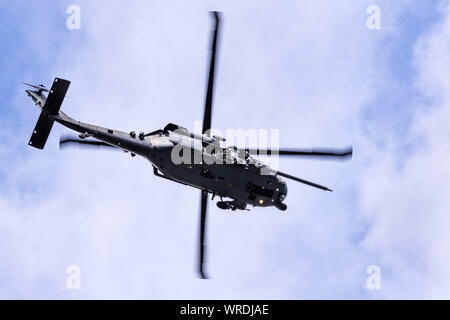 September 7, 2019 Mountain View / CA / USA -  Military helicopter performing search and rescue training exercises around Moffett Federal Airfield in S Stock Photo