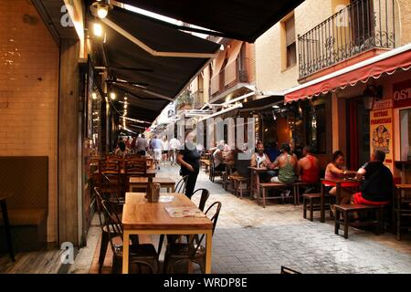 Benidorm, Alicante, Spain- September 7, 2019: Bar of typical spanish food full of people in the old town of Benidorm Stock Photo