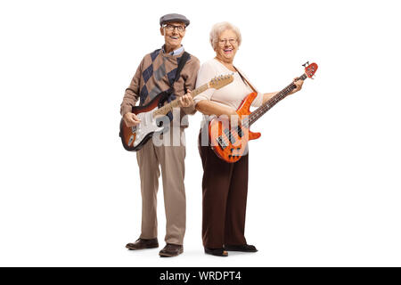 Full length portrait of an elderly man and woman playing electric guitars isolated on white background Stock Photo