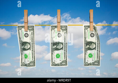 Money laundering, US Dollars drying on a washing line Stock Photo