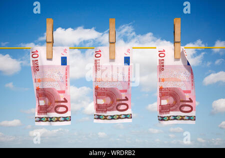 Money laundering, European Euros, 10 Euro notes drying on a washing line Stock Photo