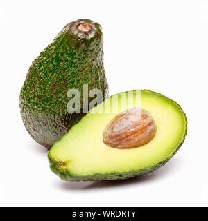 Avocados, avocado whole and sliced in half on a white background Stock Photo
