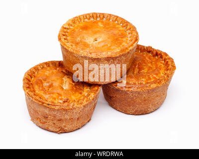 Traditional British pork pies, group of three small whole pies on a white background Stock Photo
