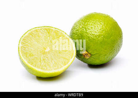 Green Lime, one whole and one half Limes on a white background Stock Photo