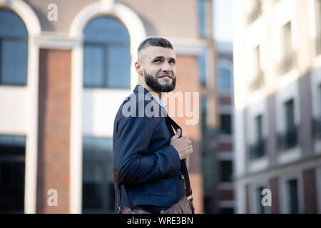 Man having good mood while walking to office in the morning Stock Photo