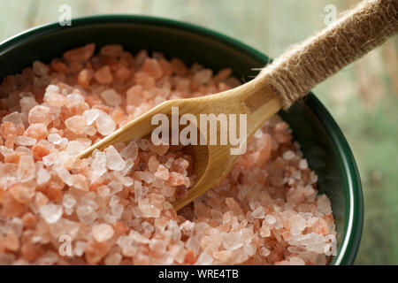 Himalayan salt on a wood table. Stock Photo