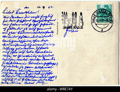 Reverse side of an old postal card with   postage stamp and handrwriting. Circa 1961 Stock Photo