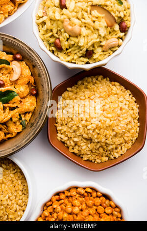 Group of Cornflake and Thick Poha Chivda or Chiwda and Chatpata Masala chana and fried crispy Moong Dal, served in a bowl. selective focus Stock Photo