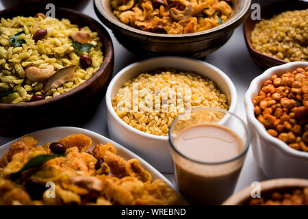 Group of Cornflake and Thick Poha Chivda or Chiwda and Chatpata Masala chana and fried crispy Moong Dal, served in a bowl. selective focus Stock Photo