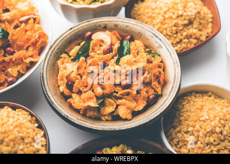 Group of Cornflake and Thick Poha Chivda or Chiwda and Chatpata Masala chana and fried crispy Moong Dal, served in a bowl. selective focus Stock Photo