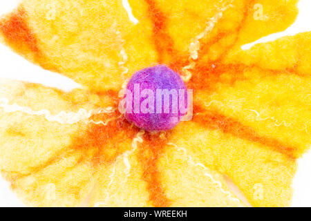 Colored wool macro - flower shape with small ball in the middle Stock Photo