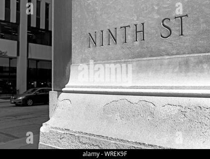 Stone inscribed 'Ninth Street' at the intersection of East 9th Street and Walnut Avenue in downtown Cleveland, Ohio, USA. Stock Photo