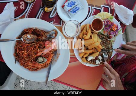 Seafood Lunch at the Seafront Cafe, Armier Bay, Malta Stock Photo