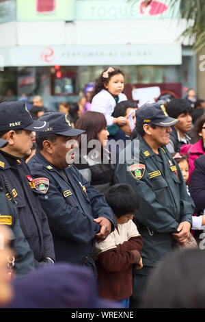 LIMA, PERU - JULY 21, 2013: Unidentified policemen on the Wong Parade in Miraflores on July 21, 2013 in Lima, Peru. Stock Photo