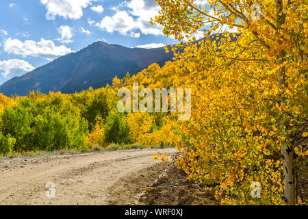 Mountain Road - Autumn view of a remote winding mountain road. Twin Lakes - Leadville, Colorado, USA. Stock Photo