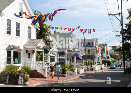 A couple walking along Commercial Street in Provincetown, Massachusetts. Stock Photo