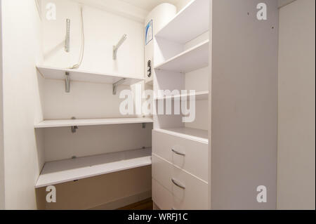 Russia, Moscow- June 15, 2018: interior room apartment. standard repair decoration in hostel. dressing room, hangers, storage system Stock Photo