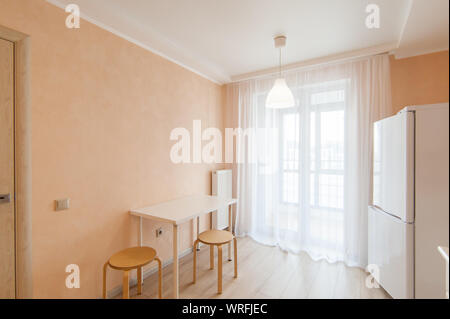 Russia, Moscow- June 15, 2018: interior room apartment. standard repair decoration in hostel. kitchen and dining room Stock Photo