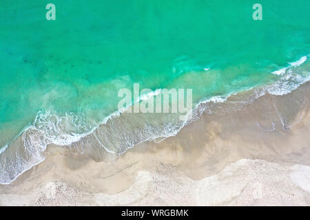 Aerial Photo of the Beach of Anna Maria Island with the Ocean Surf Coming Ashore. Stock Photo