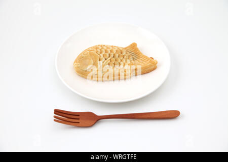 Japanese confectionery Taiyaki fish cake isolated on plate on white background Stock Photo