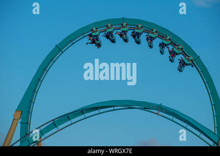 rlando, Florida. August 31, 2019. People enjoying loop in amazing Kraken rollercoaster at Seaworld Stock Photo