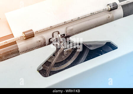Carriage with letters in a mechanical typewriter. Letter pressed, typing. Stock Photo