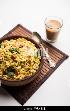 Jada Poha Namkeen Chivda / Thick Pohe Chiwda is a jar snack with a mix of sweet, salty and nuts flavours, served with tea. selective focus Stock Photo