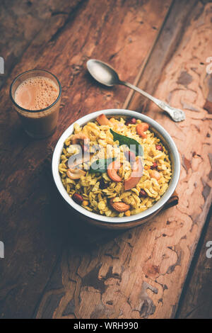 Jada Poha Namkeen Chivda / Thick Pohe Chiwda is a jar snack with a mix of sweet, salty and nuts flavours, served with tea. selective focus Stock Photo